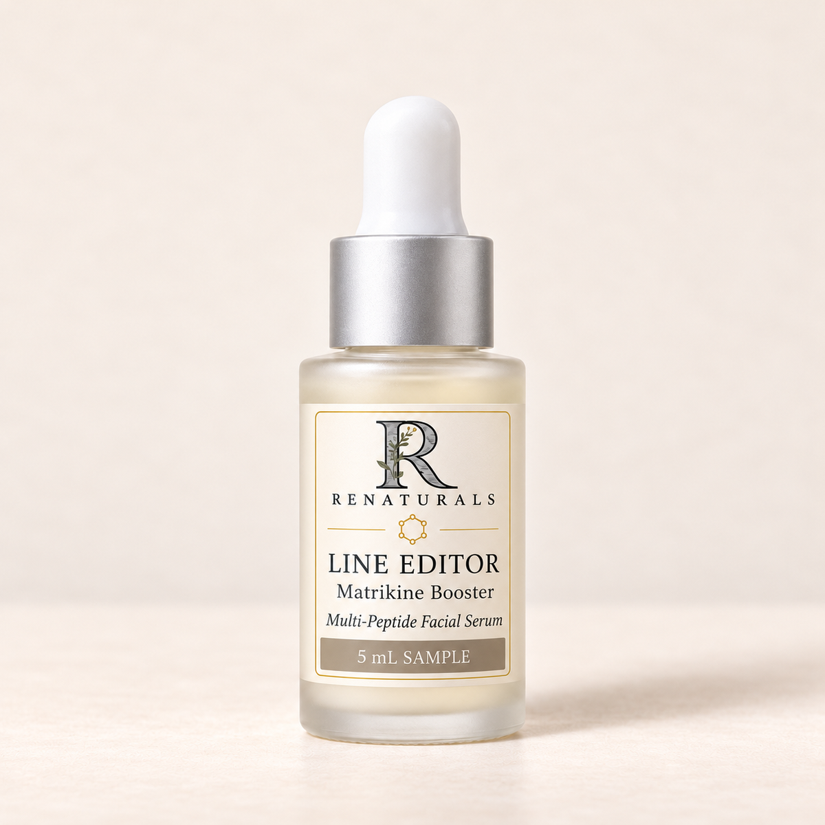 RENATURALS Line Editor Matrikine Booster 5 mL sample in frosted glass with a white dropper, matte silver collar and gold-trim ivory Botanical R label.