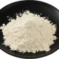 SILIGEL cosmetic gelling agent powder in a black bowl