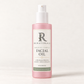 RENATURALS Bakuchiol + Vanilla Facial Oil, 2 fl oz (60 mL), in a taller pink frosted bottle with a white pump and ivory, sage and gold Botanical R label on warm ivory.