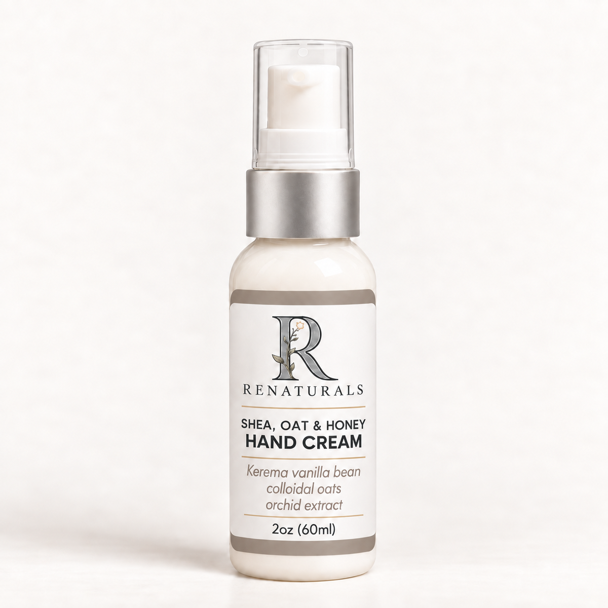 RENATURALS Shea, Oat & Honey Hand Cream, Kerema vanilla bean, in a 2oz frosted pump bottle with an ivory, taupe and soft-gold Botanical R label.
