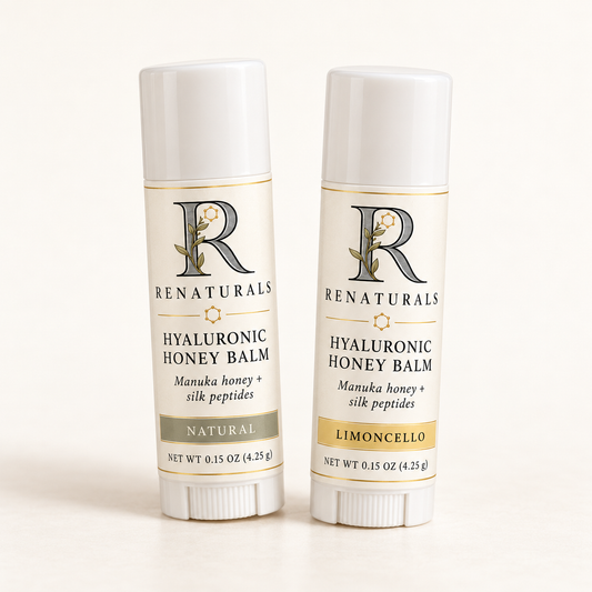 RENATURALS Hyaluronic Honey Balm, Natural and Limoncello, in white 0.15 oz lip balm sticks with Botanical R and gold-trim ivory labels.