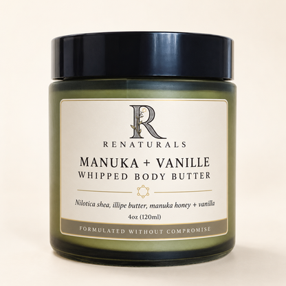 RENATURALS Manuka + Vanille Whipped Body Butter, 4oz, in a green glass jar with a black lid and ivory, taupe and gold-trim Botanical R label on warm ivory.