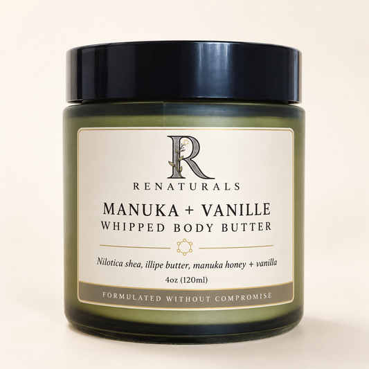 RENATURALS Manuka + Vanille Whipped Body Butter, 4oz, in a green glass jar with a black lid and ivory, taupe and gold-trim Botanical R label on warm ivory.