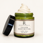 RENATURALS Tallow Body Butter in an open green glass jar, with creamy ivory whipped texture, a gold-trim Botanical R label and a black lid beside it.